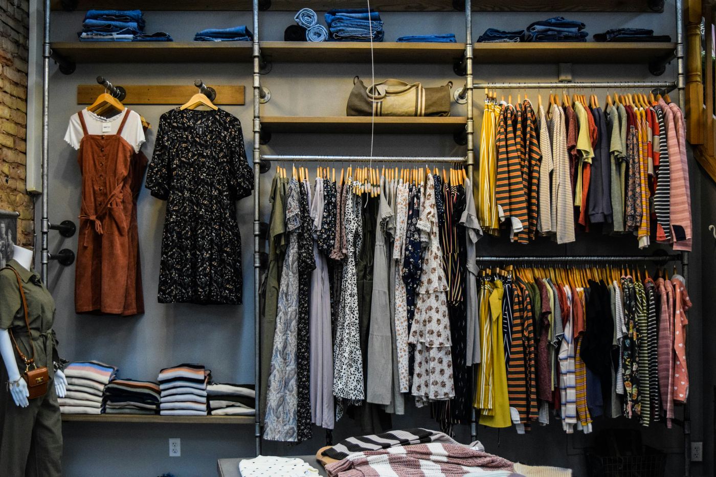 Boutique retail store with open shelving and clothing racks